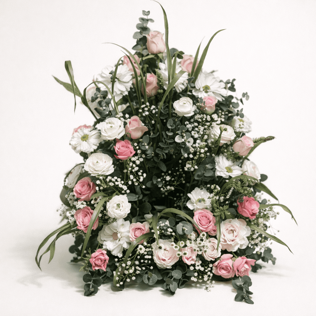 Stående sorgarrangemang med vita och rosa rosor